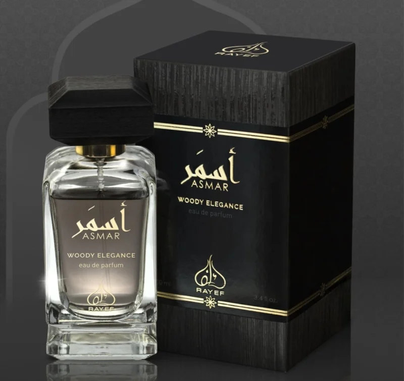 "Rayef Asmar Woody Elegance 100ml perfume bottle with a luxurious blend of woody, floral, and amber notes. A unisex fragrance perfect for any occasion, available at Breeze Aura."